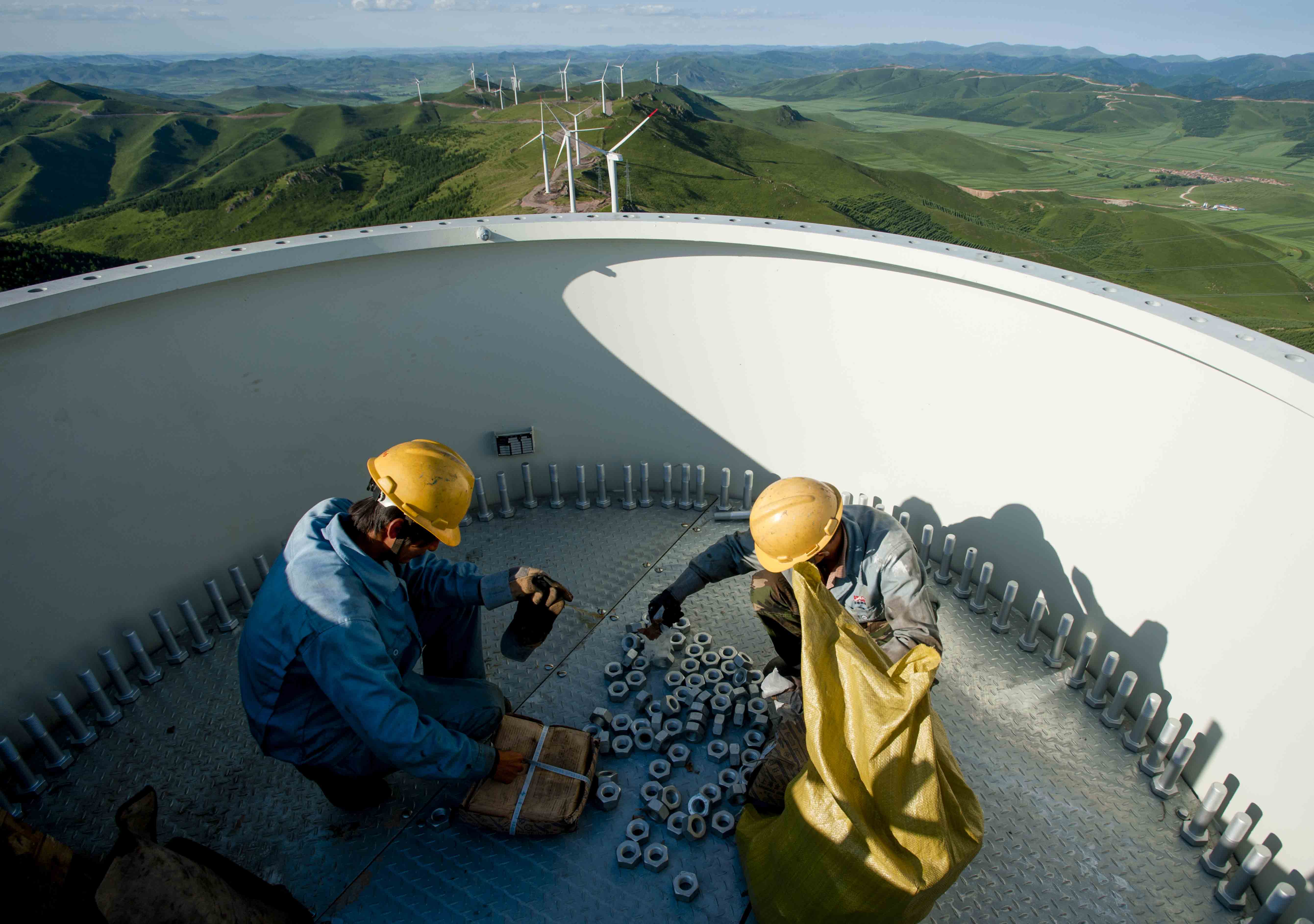Workers on turbine blade