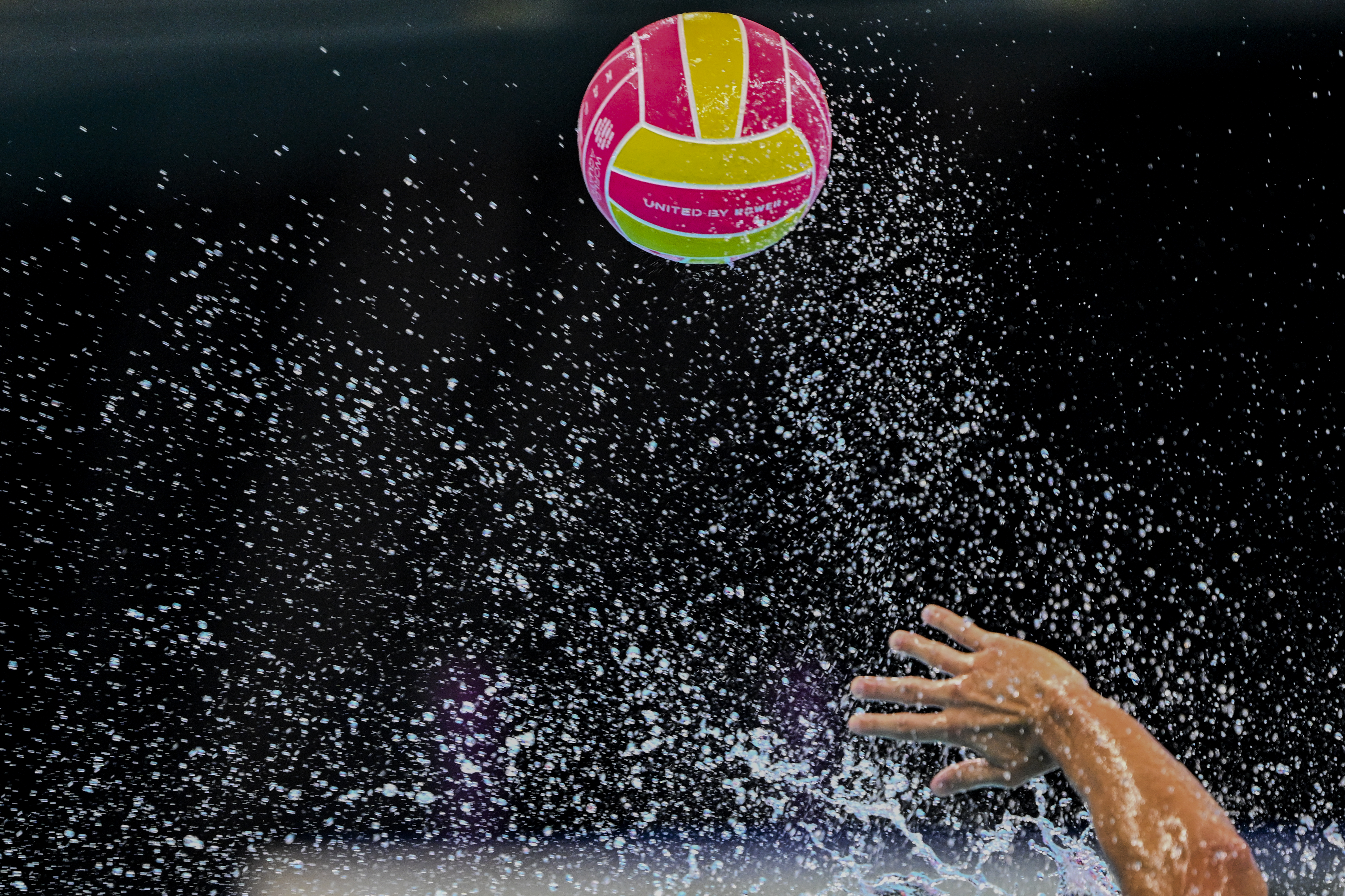 Ball, black water, hands